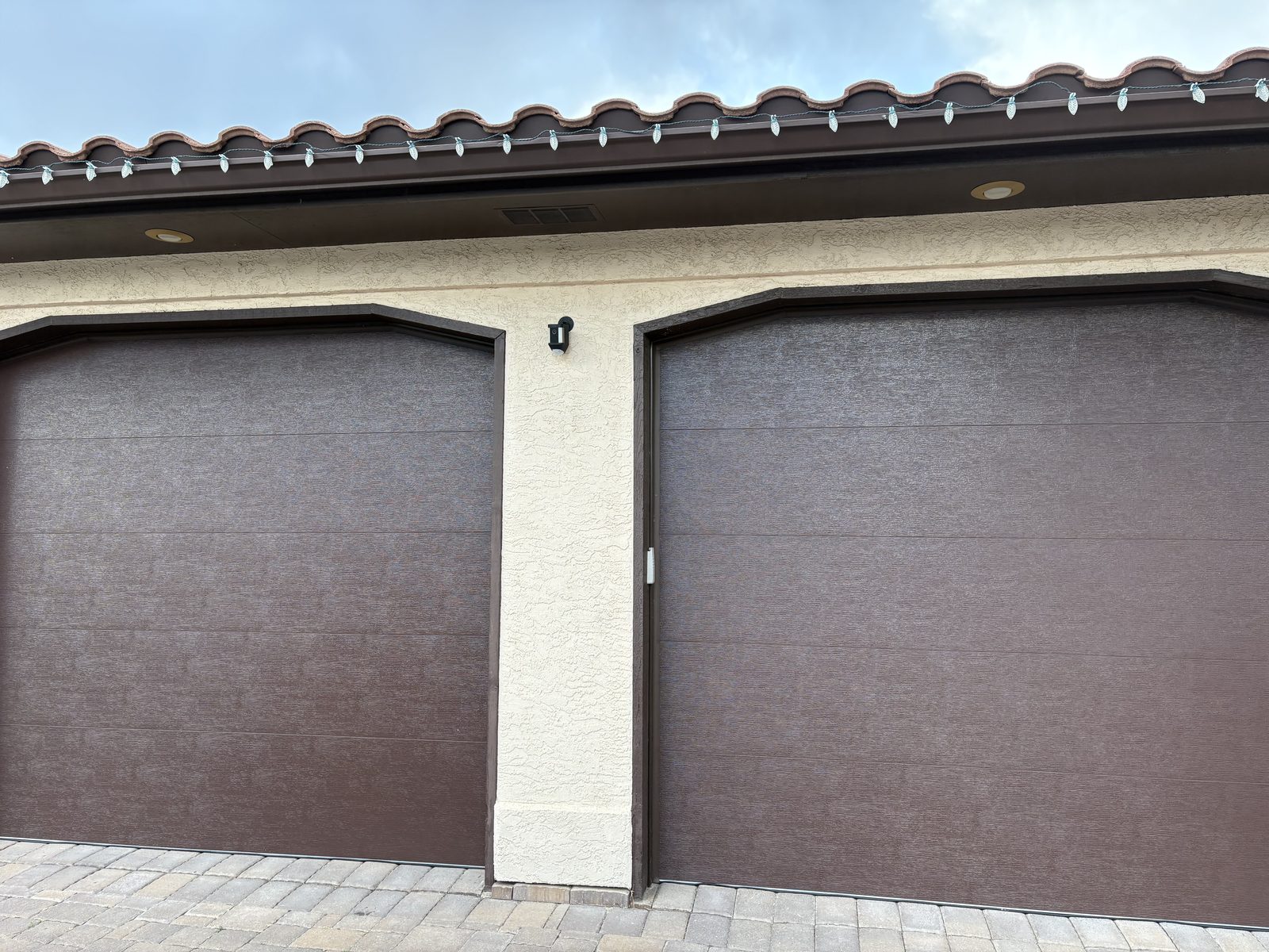 Completed brown garage door installation project