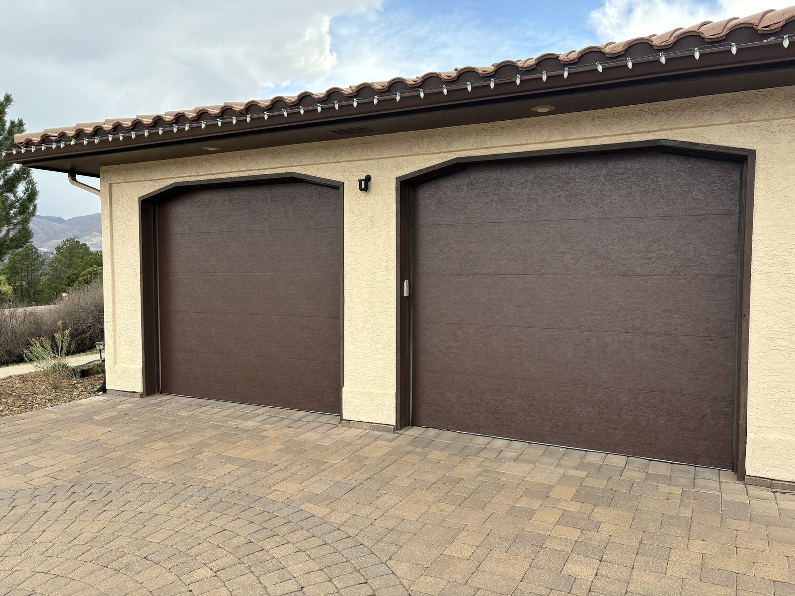 Brown garage door installation project in Colorado Springs
