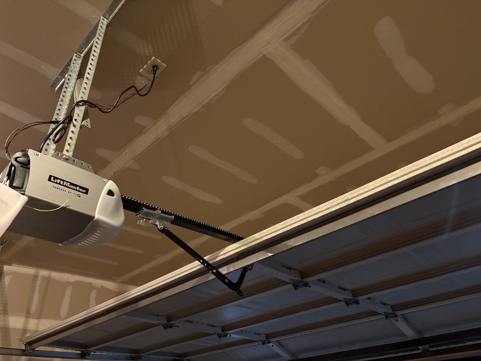 Garage door opener and ceiling track system